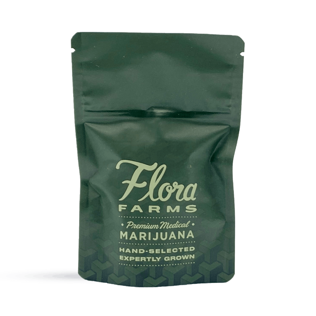 Photo of green Flora Farms packaging bag for 3.5g of cannabis with logo. Reads: Flora Farms, premium marijuana, hand-selected, expertly grown. 